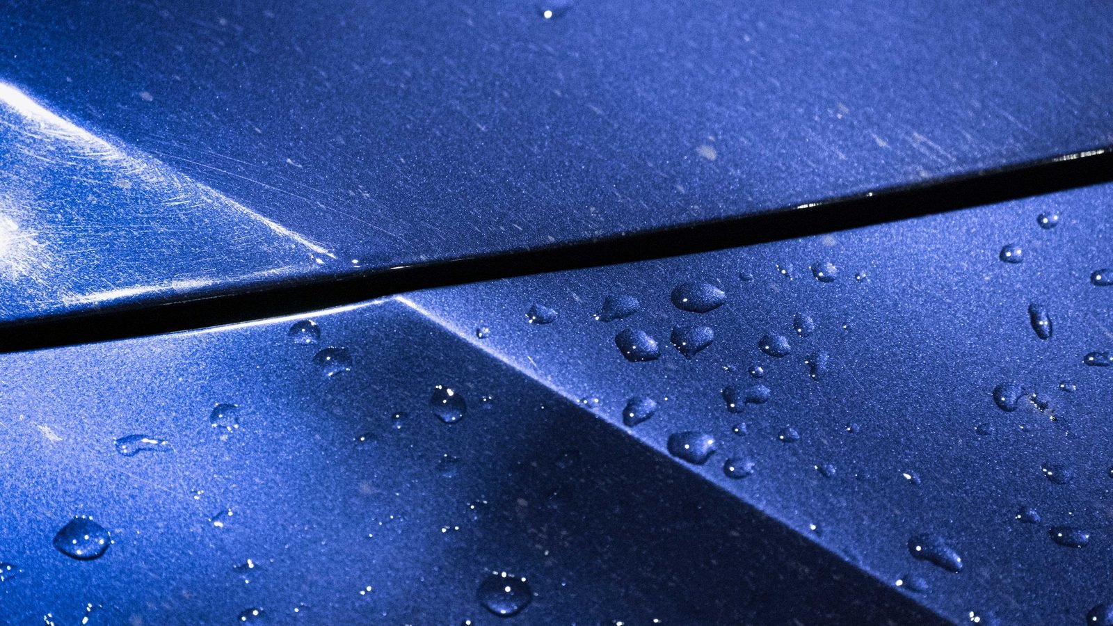 Water beading on a coated metal surface either side of a seam