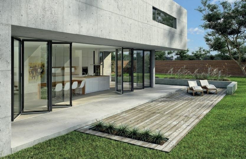 Modern glass wall on slim aluminium frames opening to a deck