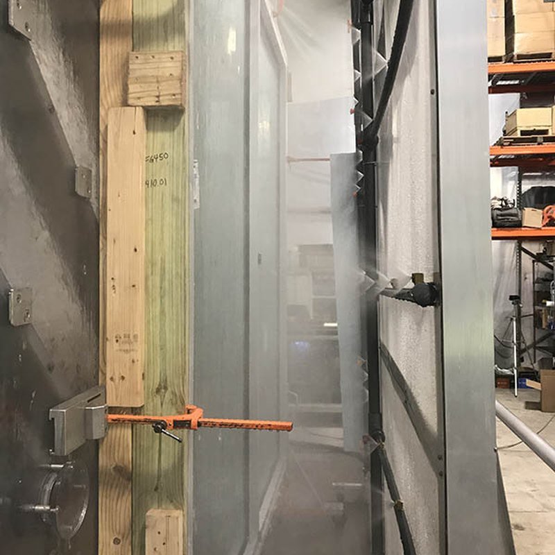 Water penetration test — the spray rig running on a glazed unit at the quality gate