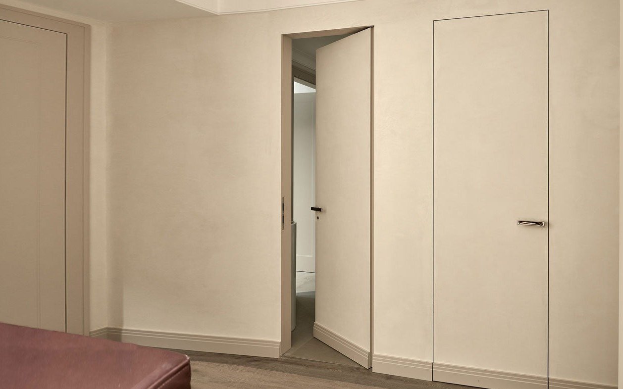 Cream folding doors on a white modern facade