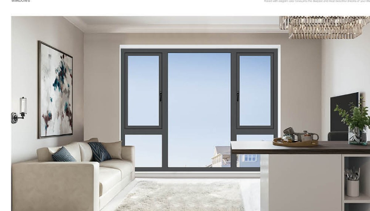 Tilt-and-turn aluminium window in a modern open-plan interior at night