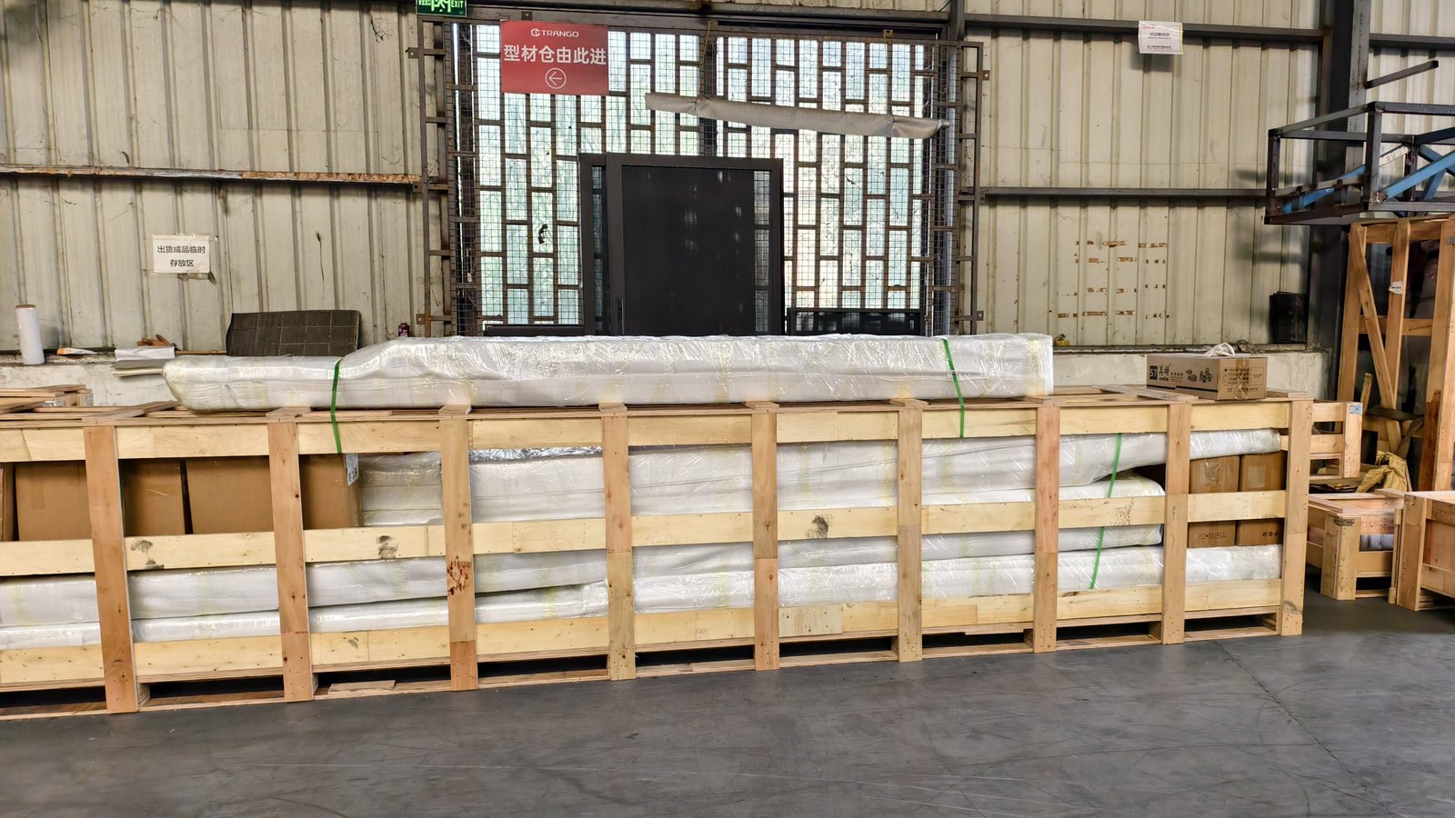 Large export timber crates lying in the packing area of the factory