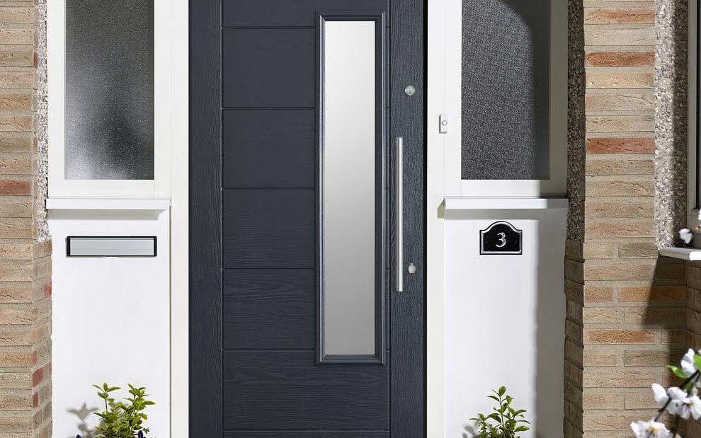 Arched timber doors on a brick entrance