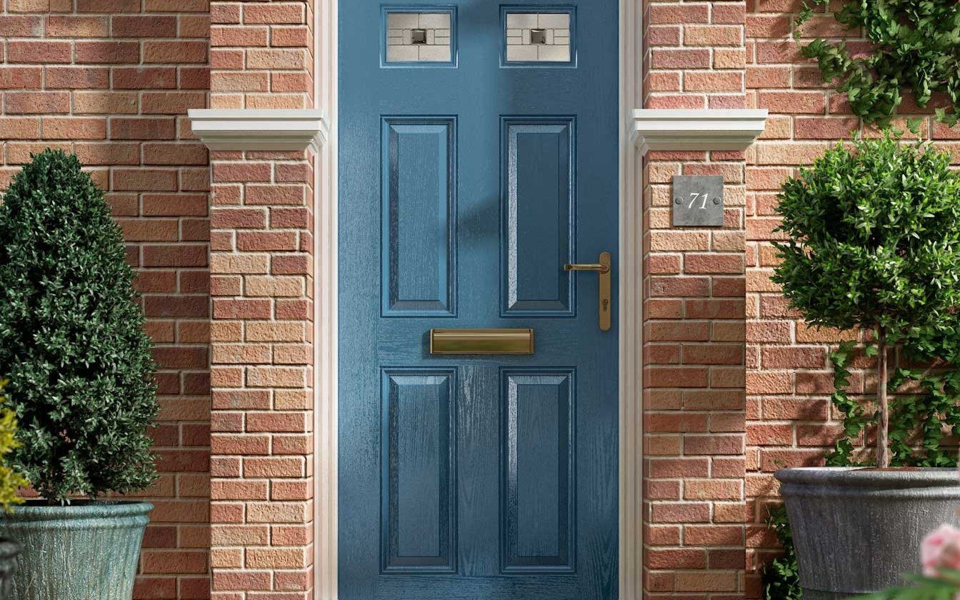Blue solid door on a brick entrance with steps